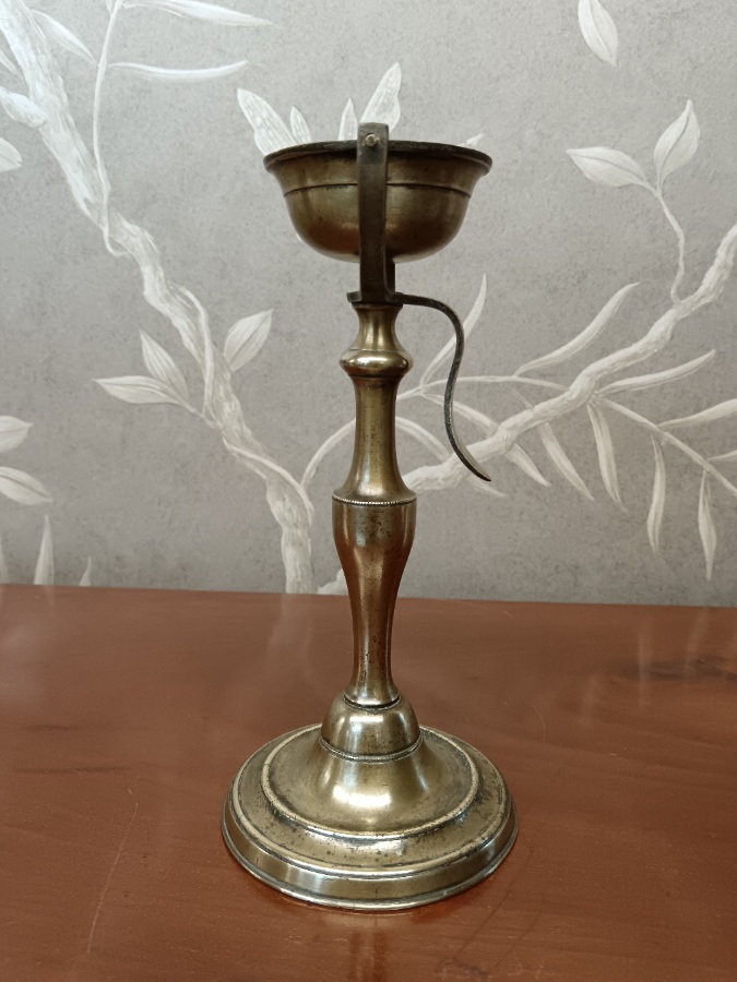 antique brass oil lamp with a gimbaled (swiveling) bowl